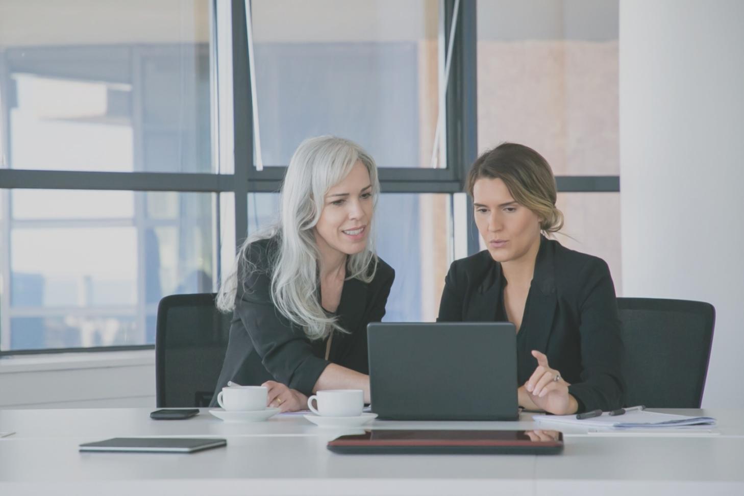 Financial analysis workspace setup with laptop and organized materials